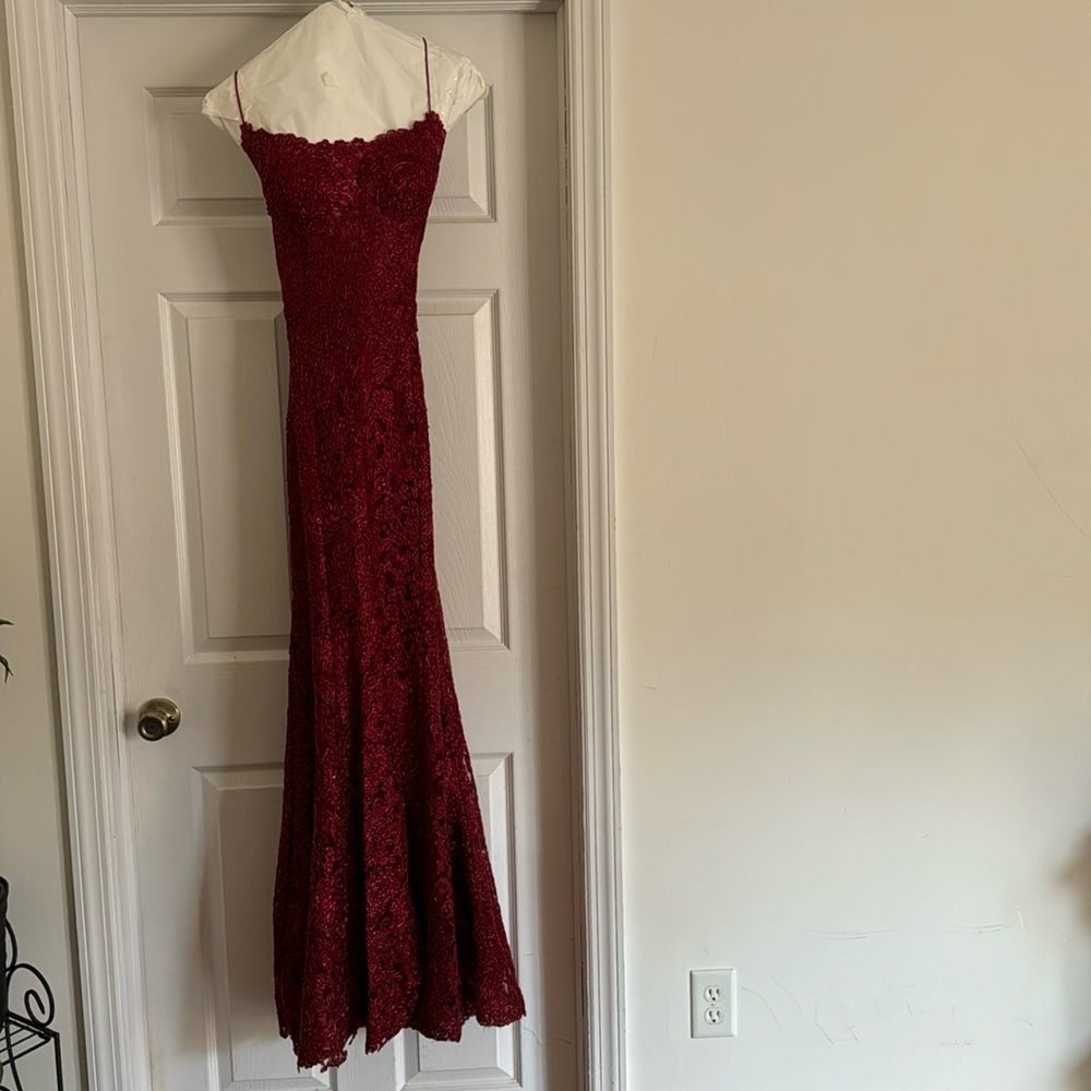 Prom gown, open back that laces up. Little train that bustles up with button